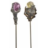 Two Edwardian hat pins the first with silvered metal thistle supporting faceted citrine and