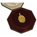 An impressive Victorian 18ct gold oval portrait locket with hinged opening revealing original