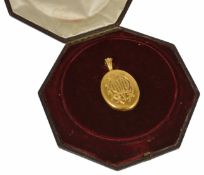 An impressive Victorian 18ct gold oval portrait locket with hinged opening revealing original