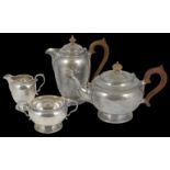 An Edwardian silver four piece tea set hallmarked London 1922 and 1923, comprising of a tea and
