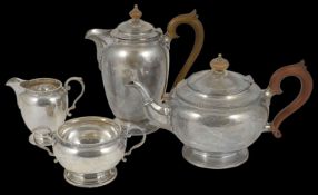 An Edwardian silver four piece tea set hallmarked London 1922 and 1923, comprising of a tea and