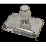 A lady's silver presentation inkwell and pen stand hallmarked Sheffield 1918, with central inkwell