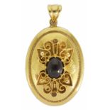 A contemporary Continental 14K hollow gold pendant of oval form with foliate scroll overlaid