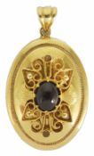 A contemporary Continental 14K hollow gold pendant of oval form with foliate scroll overlaid