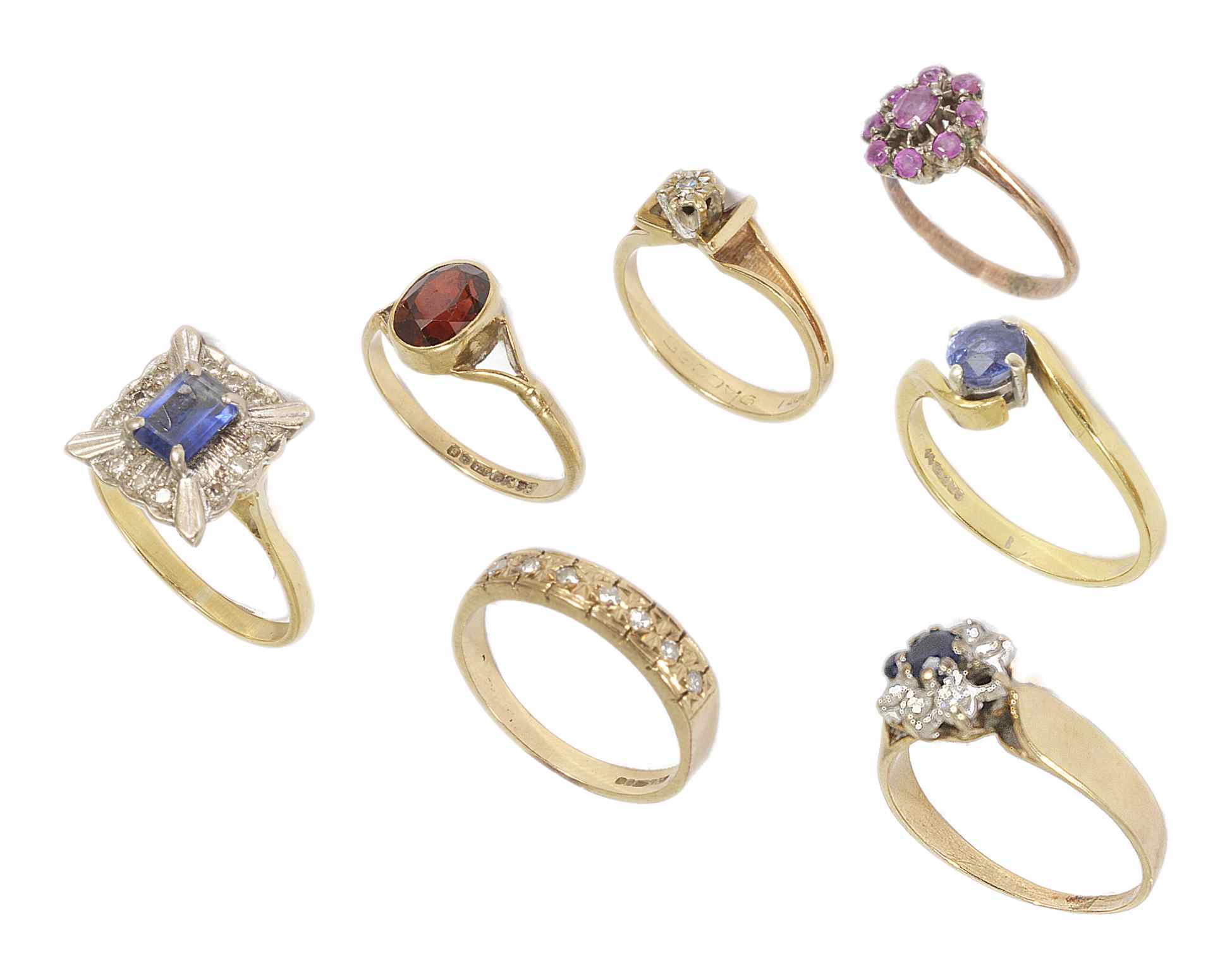 A single stone sapphire ring in 18ct gold twist mount together with six 9ct gold mounted rings