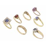 A single stone sapphire ring in 18ct gold twist mount together with six 9ct gold mounted rings