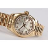 A ladies 18ct gold Rolex Oyster Perpetual Datejust bracelet watch with mother-of-pearl dial set with