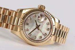 A ladies 18ct gold Rolex Oyster Perpetual Datejust bracelet watch with mother-of-pearl dial set with