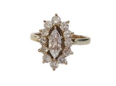 A marquis shaped diamond cluster ring with central marquis cut diamond surrounded by a single border