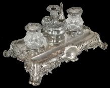 A large silver inkwell and desk stand presented to Jonathan Angus for his assistance to the