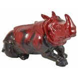 A Royal Doulton veined flambé figure of a recumbent Rhino decorated with veined and mottled effect ,