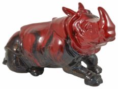 A Royal Doulton veined flambé figure of a recumbent Rhino decorated with veined and mottled effect ,