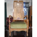 OAK BERGERE HIGH BACKED LOW SEATED ARMCHAIR