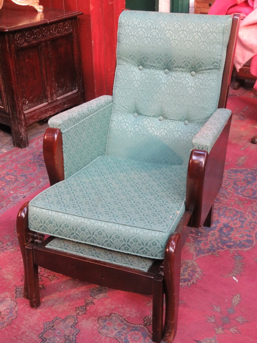 OAK AND MAHOGANY FRAMED UPHOLSTERED ARMCHAIR WITH PULL OUT FOOT STOOL AND LIFT UP TRAY TO RIGHT