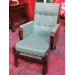 OAK AND MAHOGANY FRAMED UPHOLSTERED ARMCHAIR WITH PULL OUT FOOT STOOL AND LIFT UP TRAY TO RIGHT