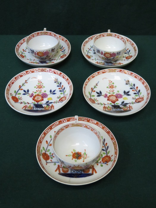 SET OF FIVE MEISSEN HANDPAINTED AND GILDED SAUCERS AND THREE FLORAL DECORATED MATCHING CUPS