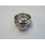 18ct WHITE GOLD SQUARE SHAPED DIAMOND CLUSTER RING WITH DIAMOND SET SHOULDERS AND A HINGED
