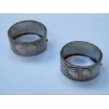 PAIR OF DECORATIVE SILVER SNAP BANGLES