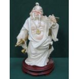 GILDED CERAMIC ORIENTAL STYLE FIGURE ON WOODEN STAND,
