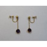 PAIR OF 9ct GOLD DROP EARRINGS SET WITH PURPLE STONES AND PEARL TYPE STONES