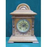 CARVED OAK CASED MANTLE CLOCK WITH CIRCULAR DIAL,