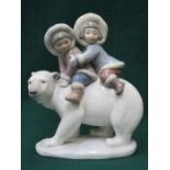 LLADRO GLAZED CERAMIC FIGURE GROUP OF TWO ESKIMOS RIDING A POLAR BEAR 17.