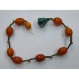 STRAND OF GRADUATED AMBER BEADS