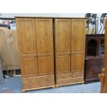 PAIR OF MODERN PINE TWO DOOR WARDROBES FITTED WITH DRAWERS