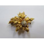 PRETTY UNHALLMARKED GOLD COLOURED LEAF BROOCH WITH MOUNTED LADYBIRD SET WITH CLEAR STONE,