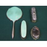 HALLMARKED SILVER AND GREEN GUILLOCHE ENAMELLED DRESSING MIRROR AND BRUSH.