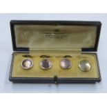 CASED SET OF THREE MOTHER OF PEARL DRESS BUTTONS AND ONE ODD DRESS BUTTON