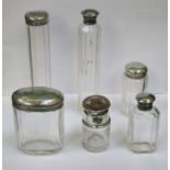 SIX VARIOUS HALLMARKED SILVER TOPPED GLASS DRESSING JARS