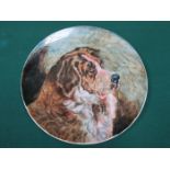 HANDPAINTED CIRCULAR CERAMIC CHARGER DEPICTING A ST BERNARD, STAMPED PINDER BOURNE & CO,