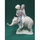 LLADRO GLAZED CERAMIC FIGURE GROUP OF BOY AND GIRL RIDING AN ELEPHANT 24cm