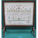 MAHOGANY FIRESCREEN WITH MOUNTED AND GLAZED SAMPLER,