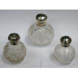 THREE VARIOUS SILVER TOPPED GLASS PERFUME DECANTERS