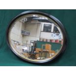 EBONISED AND GILDED OVAL BEVELLED WALL MIRROR