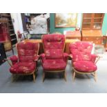 THREE VARIOUS ERCOL UPHOLSTERED ARMCHAIRS