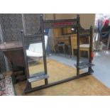 GILDED EBONISED PIERCEWORK DECORATED OVER MANTLE MIRROR