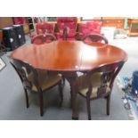 CARVED MAHOGANY GATELEG DINING TABLE ON BALL AND CLAW SUPPORTS PLUS SIX CHAIRS