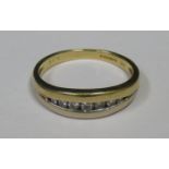 18ct GOLD RING SET WITH SEVEN CLEAR STONES