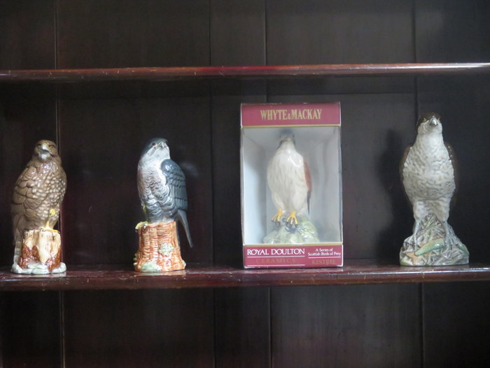 FOUR VARIOUS BESWICK CERAMIC WHISKEY DECANTERS - OSPREY PEREGRINE FALCON, KESTREL AND BUZZARD.