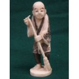 HEAVILY CARVED IVORY FIGURE OF AN ORIENTAL GENTLEMAN,