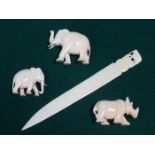 1920s/30s CARVED IVORY LETTER KNIFE AND THREE ANIMALS INCLUDING TWO ELEPHANTS AND RHINO