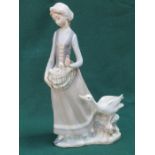 LLADRO GLAZED CERAMIC FIGURE OF A LADY WITH GEESE.