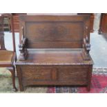 HEAVILY CARVED OAK MONKS BENCH WITH LIFT UP SEAT