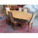 MODERN OAK EXTENDING DINING TABLE AND SIX CHAIRS