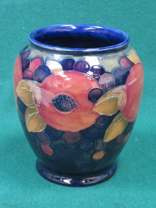 MOORCROFT POMEGRANATE PATTERN TUBE LINED CERAMIC VASE, INITIALED TO THE BASE AND NUMBERED 348.