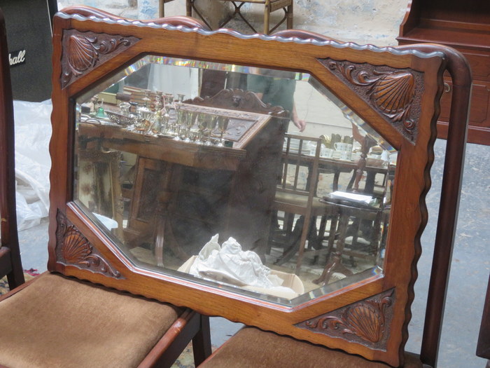 CARVED MAHOGANY FRAMED AND BEVELLED WALL MIRROR