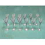 SET OF TWELVE ETCHED DRINKING GLASSES